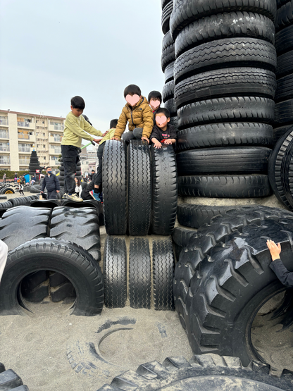 Retro shopping street and tire Godzilla park