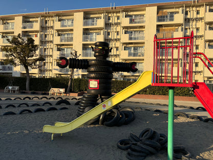 Retro shopping street and tire Godzilla park