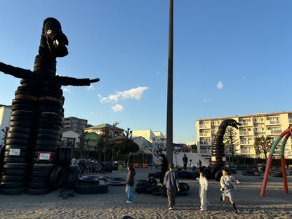 Retro shopping street and tire Godzilla park